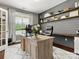 Comfortable home office with a large window offering natural light and a view of the outdoors at 4013 Hamilton Mill Dr, Waxhaw, NC 28173