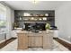 Well-lit home office featuring a large desk, ample shelving, and neutral decor at 4013 Hamilton Mill Dr, Waxhaw, NC 28173