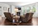 Inviting living room with fireplace, large windows and comfortable seating with hardwood floors at 4013 Hamilton Mill Dr, Waxhaw, NC 28173