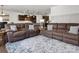 Open concept living room and kitchen area with comfortable seating and hardwood floors at 4013 Hamilton Mill Dr, Waxhaw, NC 28173