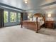 Spacious main bedroom with natural light, a tray ceiling, and plush carpeting for a luxurious retreat at 4013 Hamilton Mill Dr, Waxhaw, NC 28173