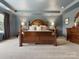 Elegant main bedroom featuring a trey ceiling, creating a cozy and inviting atmosphere with ample natural light at 4013 Hamilton Mill Dr, Waxhaw, NC 28173