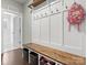 Inviting mudroom with a built-in bench, storage cubbies, and convenient coat hooks for easy organization at 4013 Hamilton Mill Dr, Waxhaw, NC 28173
