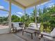 Relaxing screened porch features comfortable seating and views of the lush backyard at 4013 Hamilton Mill Dr, Waxhaw, NC 28173