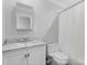 Bright bathroom featuring a marble countertop, neutral walls, and combination shower and bathtub at 4024 Tyndale Ave, Charlotte, NC 28210