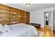 Primary bedroom features a full wall of built-in shelves and convenient access to the ensuite bathroom at 4024 Tyndale Ave, Charlotte, NC 28210