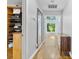 Hallway with hardwood floors, a built-in closet, and a view of the outdoors at 4024 Tyndale Ave, Charlotte, NC 28210