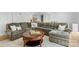 Cozy living room with a large sectional sofa, a round coffee table, and plush carpeting at 4024 Tyndale Ave, Charlotte, NC 28210
