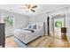 Comfortable main bedroom featuring a plush bed, hardwood floors, and ample natural light at 4024 Tyndale Ave, Charlotte, NC 28210