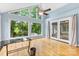 Sunlit office featuring hardwood floors and large windows with private outdoor view at 4024 Tyndale Ave, Charlotte, NC 28210