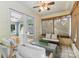Inviting sunroom featuring lots of natural light, comfortable seating, and access to another sunroom at 4024 Tyndale Ave, Charlotte, NC 28210