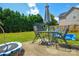 Backyard patio with outdoor furniture, trampoline, and green lawn at 4075 Clover Nw Rd, Concord, NC 28027