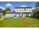 Wide shot of backyard with a patio and play area at 4075 Clover Nw Rd, Concord, NC 28027