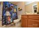 Quirky bathroom showcasing Star Wars-themed shower curtain, and vanity at 4075 Clover Nw Rd, Concord, NC 28027