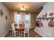 Cozy dining room features a wood table, white chairs, and natural light at 4075 Clover Nw Rd, Concord, NC 28027
