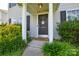 Charming front door with decorative wreath and landscaping at 4075 Clover Nw Rd, Concord, NC 28027