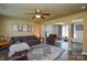 Comfortable living room showcases a neutral color scheme, wood flooring, and open archway at 4075 Clover Nw Rd, Concord, NC 28027