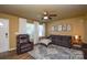 Cozy living room features a comfortable sofa, recliner, and a stylish area rug at 4075 Clover Nw Rd, Concord, NC 28027