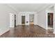 Unfinished basement with hardwood floors, white walls, with doorways to other rooms and staircase at 4315 Palm Dr, Denver, NC 28037
