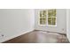 Bright bedroom features natural light from large windows and wood-look flooring at 4315 Palm Dr, Denver, NC 28037