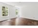 Bright bedroom features natural light from windows and wood-look flooring at 4315 Palm Dr, Denver, NC 28037