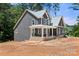 New home with a front porch, gray siding, set on a large lot at 4315 Palm Dr, Denver, NC 28037