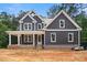 New construction featuring a covered front porch, board and batten siding, and professionally designed trim at 4315 Palm Dr, Denver, NC 28037