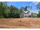 New home with a front porch, gray siding, set on a large lot at 4315 Palm Dr, Denver, NC 28037