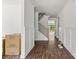 Spacious hallway with hardwood floors, wainscoting, and a view of the stairs at 4315 Palm Dr, Denver, NC 28037