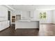 Beautiful kitchen featuring a large island, white cabinets, and ample counter space at 4315 Palm Dr, Denver, NC 28037