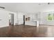 Spacious kitchen with a large island, white cabinets, and view to the stairs at 4315 Palm Dr, Denver, NC 28037