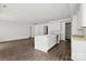 Bright kitchen featuring an island, white cabinets, and wood-look floors at 4315 Palm Dr, Denver, NC 28037