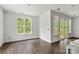 Sunlit living room with large windows and sliding door at 4315 Palm Dr, Denver, NC 28037