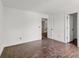 Open living room featuring hardwood floors, and two doors leading to other rooms at 4315 Palm Dr, Denver, NC 28037