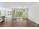 Living room area featuring sliding glass doors, hardwood flooring and lots of windows at 4315 Palm Dr, Denver, NC 28037