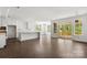 Spacious living room area with a wall of windows and sliding glass doors to the porch at 4315 Palm Dr, Denver, NC 28037