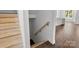 Unfinished staircase with natural wood steps leading to the upper and lower levels of the home at 4315 Palm Dr, Denver, NC 28037