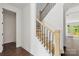 New staircase with neutral tones, hardwood treads, and iron balusters at 4315 Palm Dr, Denver, NC 28037