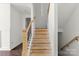 Stairway with unfinished steps and natural wood railing at 4315 Palm Dr, Denver, NC 28037