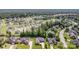 Expansive aerial view of a neighborhood with tree-lined streets and well-maintained homes at 4409 Winder Trl, Gastonia, NC 28056