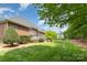 Lush backyard with green grass and mature trees, creating a private oasis at 4409 Winder Trl, Gastonia, NC 28056