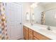 Bathroom featuring double sink vanity, large mirror, and bathtub with shower at 4409 Winder Trl, Gastonia, NC 28056