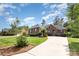 Charming brick home boasts a manicured lawn, mature trees, and a welcoming driveway at 4409 Winder Trl, Gastonia, NC 28056