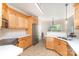 Well-lit kitchen with stainless steel appliances, quartz countertops, and plenty of cabinet space at 4409 Winder Trl, Gastonia, NC 28056