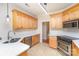 Bright kitchen with light wood cabinets, stainless steel appliances, and updated countertops at 4409 Winder Trl, Gastonia, NC 28056