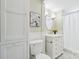 This bathroom has a toilet, vanity, and tub with shower at 448 Union S St, Concord, NC 28025