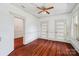 This bedroom features hardwood floors, two closets, and a big window with classic shutters at 448 Union S St, Concord, NC 28025