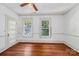 Bedroom features hardwood floors, two windows for lots of natural light and white trim at 448 Union S St, Concord, NC 28025