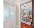 A dining room showcases a wooden table, upholstered chairs, and a modern chandelier at 448 Union S St, Concord, NC 28025