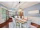 Stylish dining room with hardwood floors, chandelier and view into living room at 448 Union S St, Concord, NC 28025
